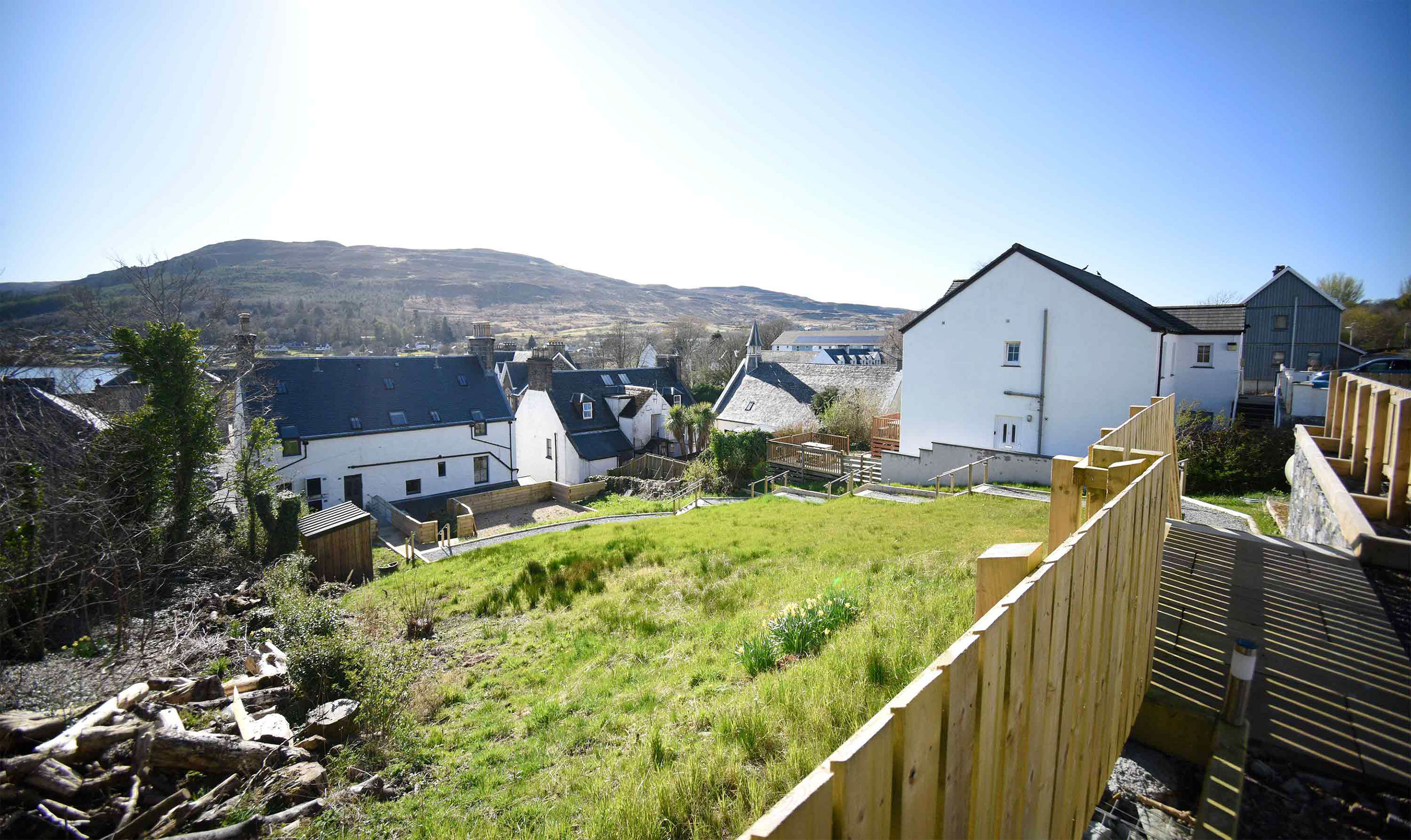 Relax in Taransay House Luxury Accommodation in Portree public seating area with woodburning stove