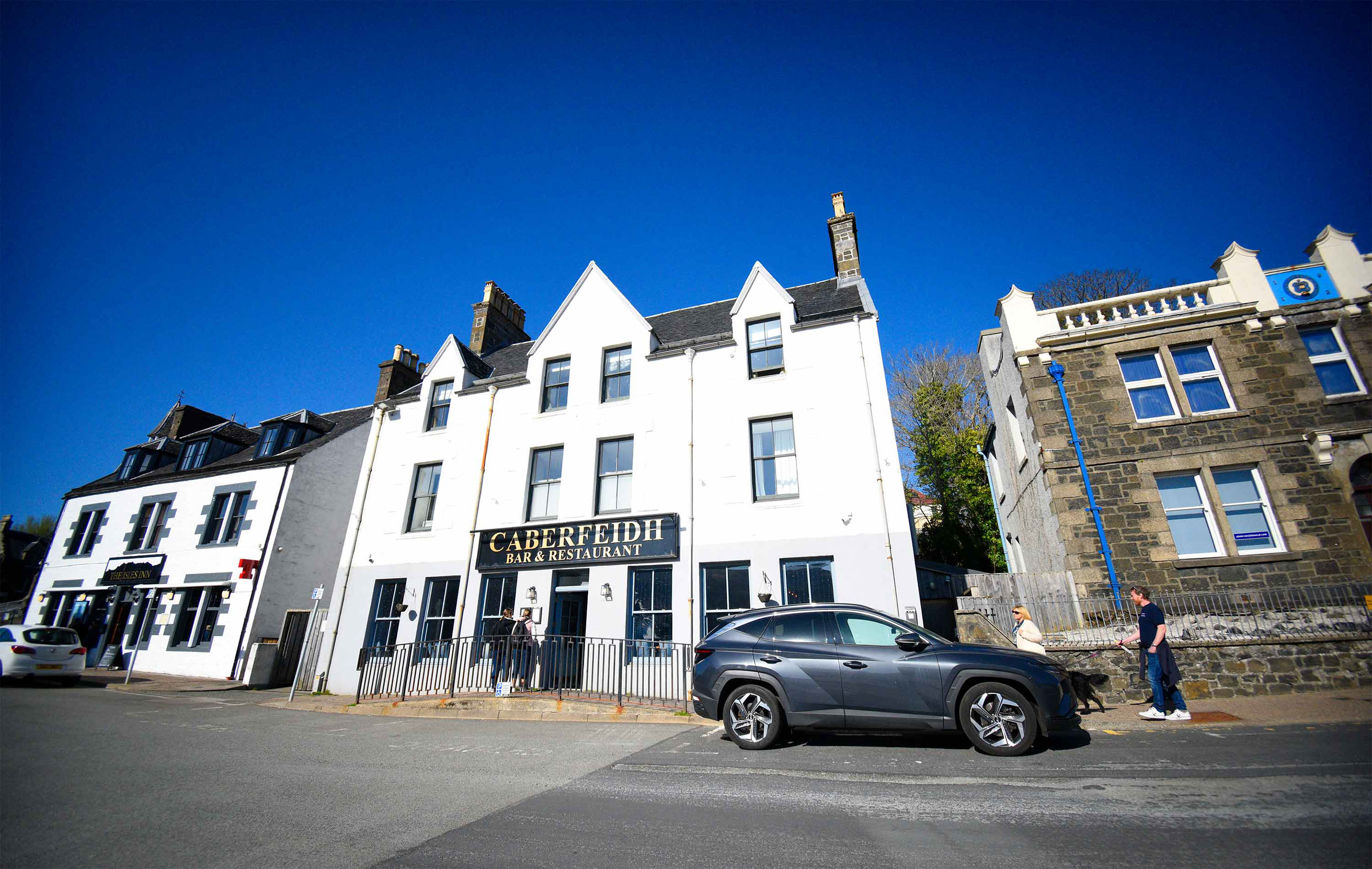 Relax in Taransay House Luxury Accommodation in Portree public seating area with woodburning stove