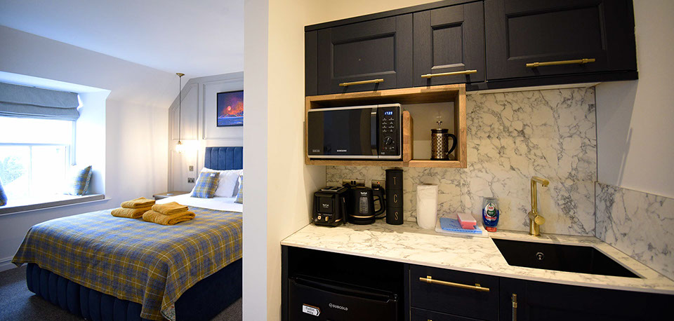 Somerled House Suites self catering accommodation apartments contain a King size bed and kitchenette Portree accommodation