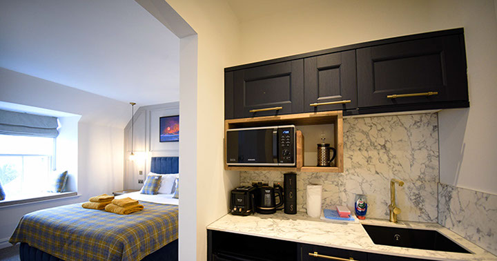 Somerled House Suites self catering accommodation apartments contain a King size bed and kitchenette Portree accommodation