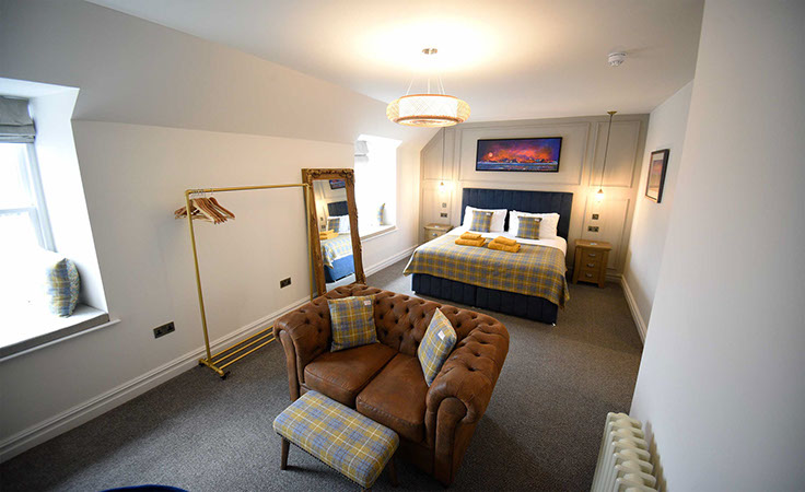 Somerled House Suites contain a King size bed with all bedding and linen provided and a cost seating area with widescreen TV