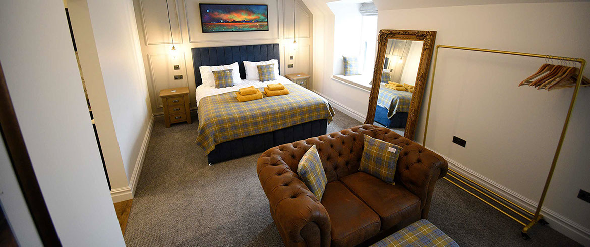 Somerled House Suites contain spacious rooms with King Size beds and cosy seating area at our self catering Portree accommodation