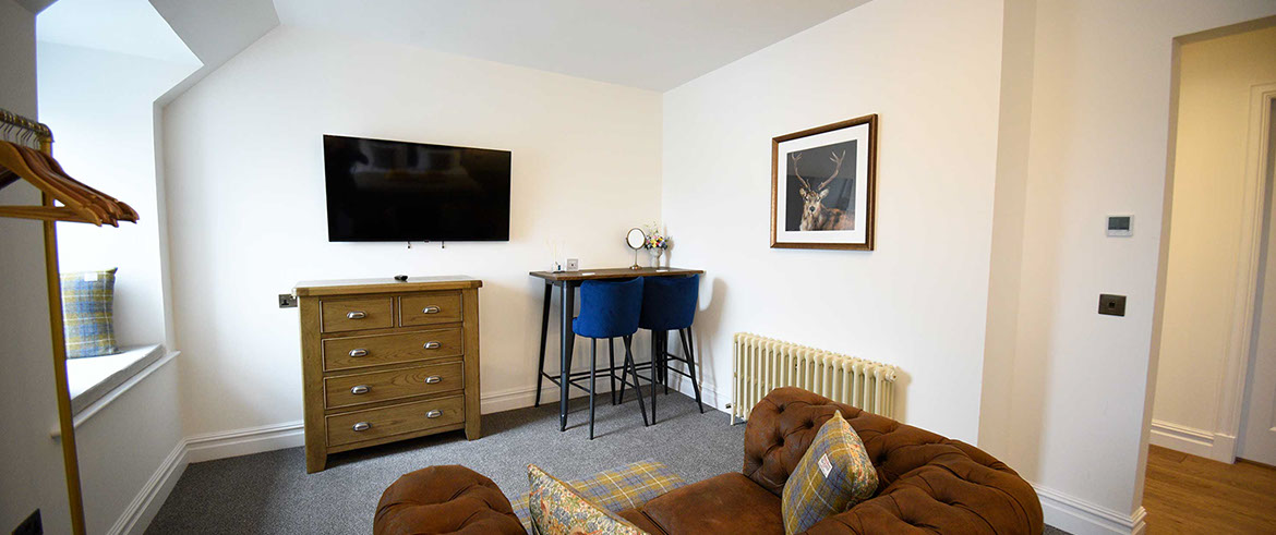 Our Portree accommodation Somerled House Suites contains a cosy living room with widescreen TV