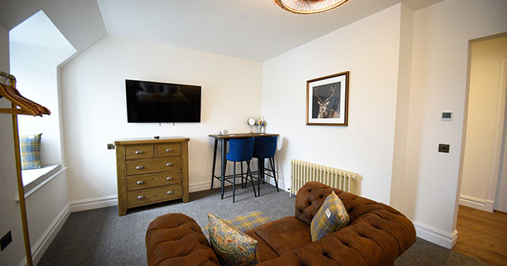 Our Portree accommodation Somerled House Suites contains a cosy living room with widescreen TV